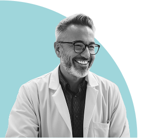 Smiling man wearing glasses and a lab coat, set against a soft blue abstract background.