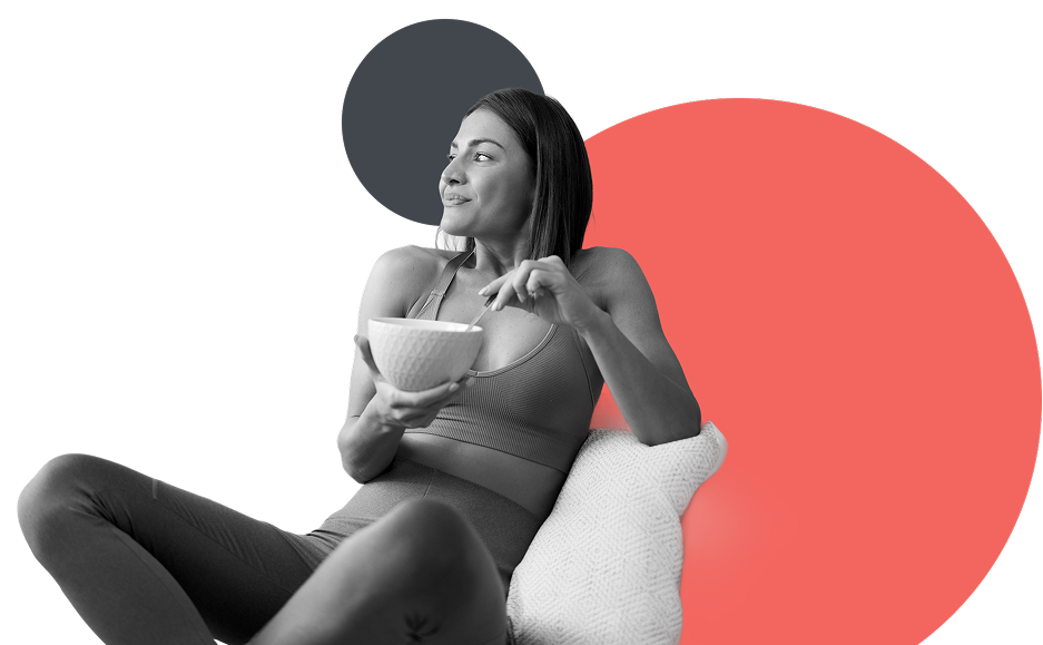 Woman sitting on a chair holding a bowl with colorful circles around her.